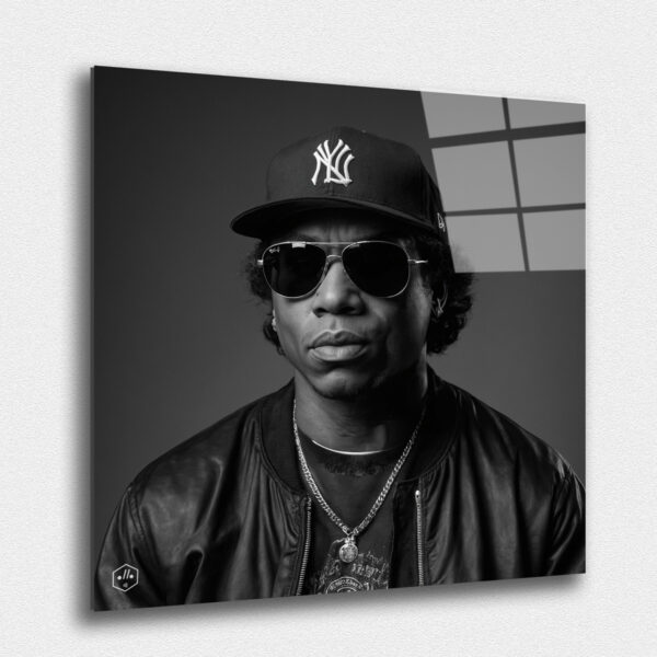 "A hyperrealistic black-and-white portrait of Eazy-E in the classic Studio Harcourt style. "A hyperrealistic black-and-white portrait of Eazy-E in the classic Studio Harcourt style. ""Legends Never Die: Timeless Portraits of Fallen Hip-Hop Icons in Harcourt Elegance"" captures the enduring spirit and cultural impact of the most iconic figures in hip-hop history. This exclusive collection presents each legendary artist in the timeless black-and-white style of Studio Harcourt, blending their powerful presence with classic elegance. The portraits pay tribute to the creativity, resilience, and influence of these fallen icons, immortalizing their legacy with unmatched sophistication. A must-have for collectors and fans alike, this series is a celebration of the enduring power of music, culture, and the voices that continue to inspire generations."