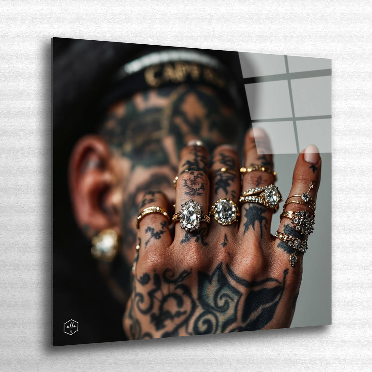 Tattooed hand dripping with diamond rings, caught by paparazzi flash.